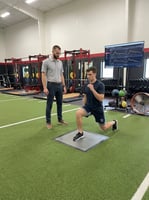 Athlete undergoing movement assessment at a sports physical therapy clinic in San Antonio